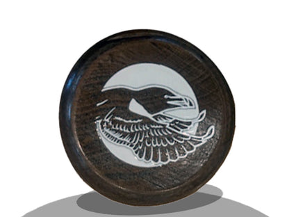 Close-up of the knob on a Razorbill bat featuring the bird logo design