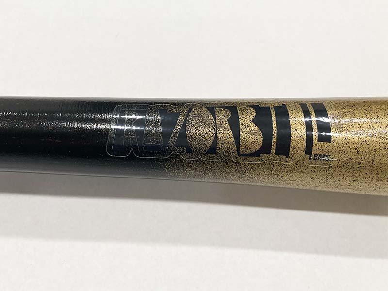 Razorbill bat featuring a stunning gold fade that transitions into a sleek black handle, with the signature Razorbill logo elegantly engraved on the barrel.