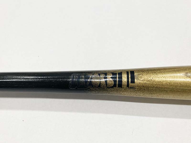 Razorbill bat featuring a stunning gold fade that transitions into a sleek black handle, with the signature Razorbill logo elegantly engraved on the barrel.