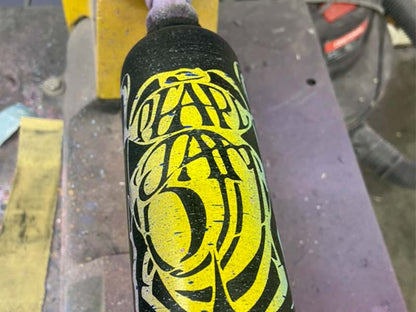 Razorbill bat with a bold yellow Pearl Jam–inspired design set against a deep black background, combining music-inspired style with premium bat craftsmanship.