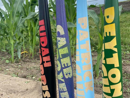 Razorbill bats featuring bold, large-font name designs across the barrels, showcasing custom personalization and standout visual appeal.