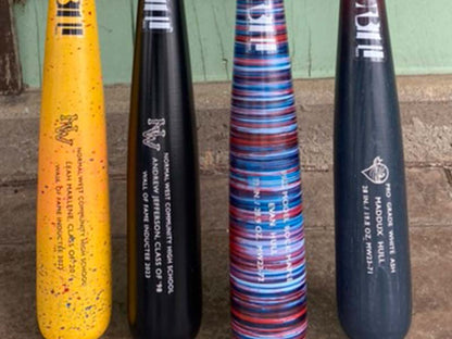 Razorbill bats showcasing a variety of designs including bold stripes, solid colors, and speckled patterns, each highlighting unique craftsmanship and custom finishes.