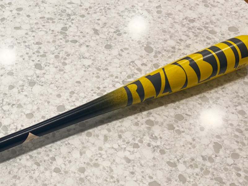 Razorbill fungo bat featuring the brand’s signature logo, designed for coaches with a focus on durability, control, and style during infield and outfield drills.